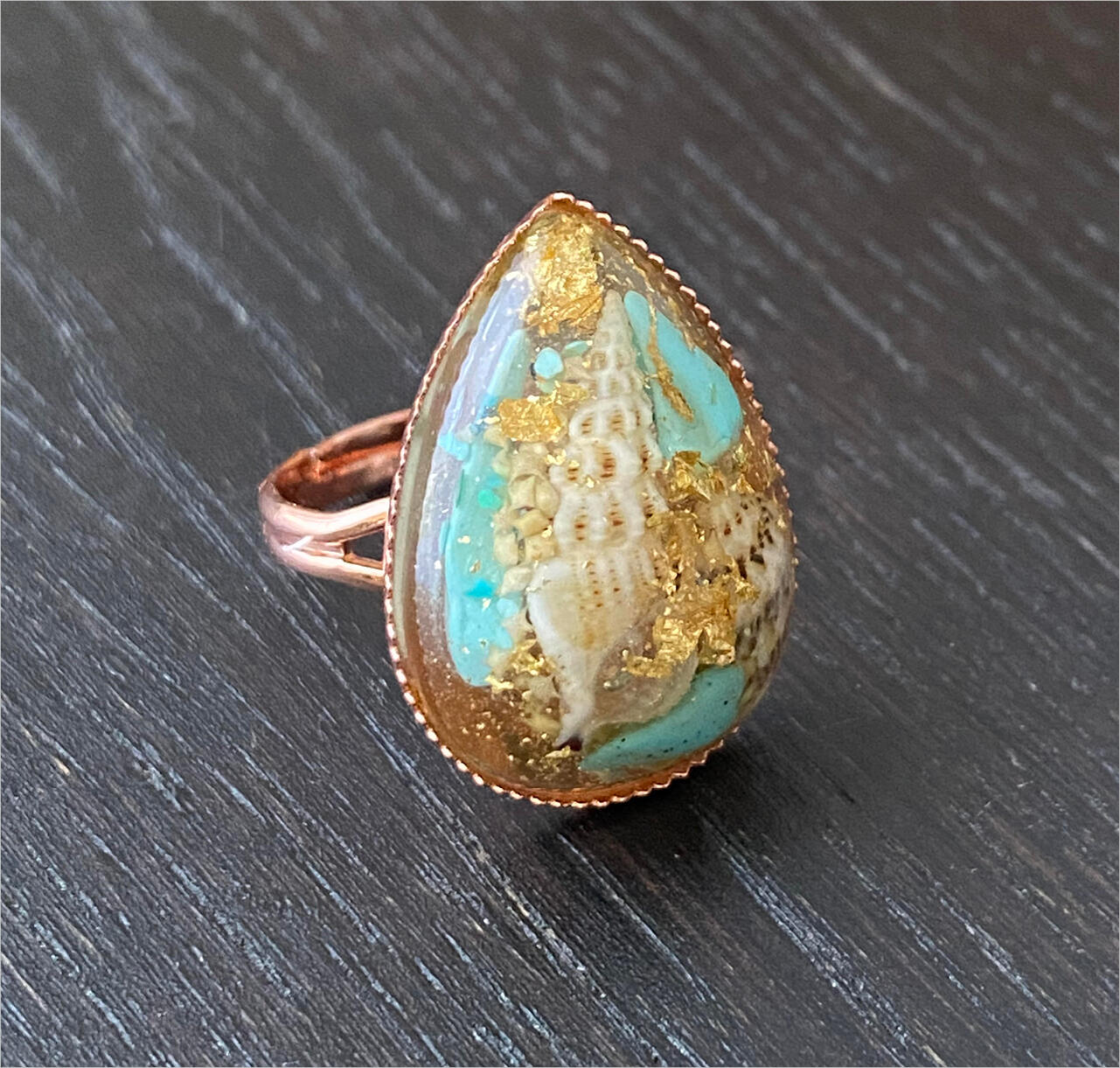 Rose gold resin ring made with shells, turquoise, sand and gold leaf